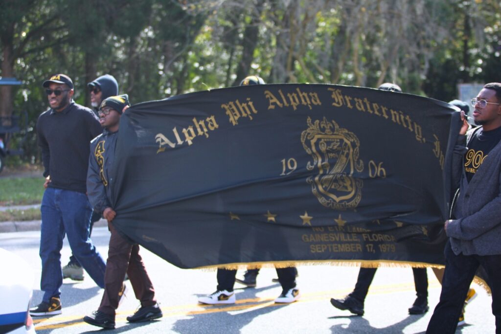 Members of the Alpha Phi Alpha fraternity of Gainesville march down Waldo Road in the annual MLK Day Parade. Photo by Lillian Hamman
