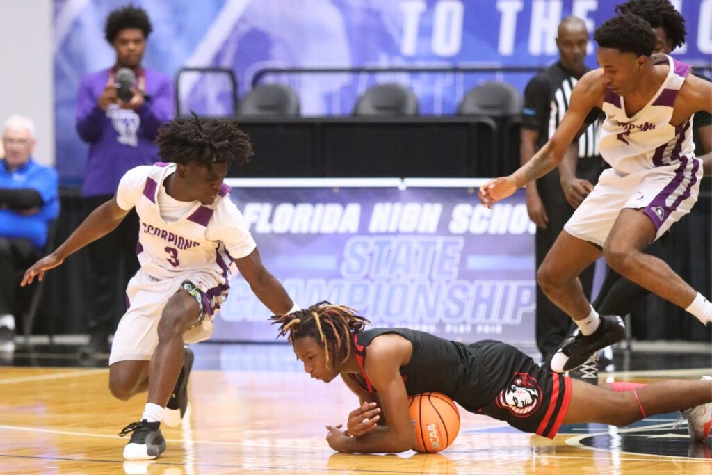 Fort White's Desean Lally (2) dives on a loose ball against Crossroad Academy (Quincy) in the Rural State Semifinals. Photo by C.J. Gish