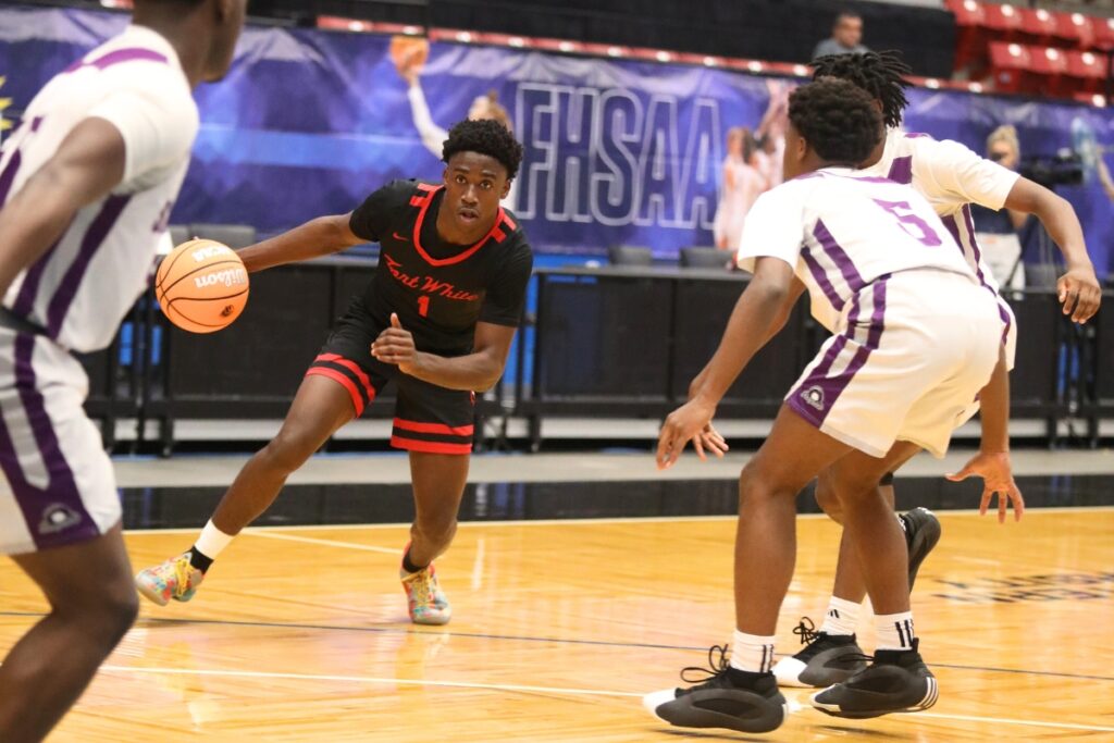 Fort White's Jayden Jackson (1) drives to the basket against Crossroad Academy (Quincy) in the Rural State Semifinals. Photo by C.J. Gish