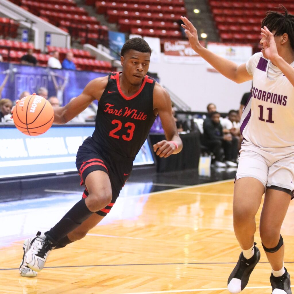 Fort White's Kendal Henry (23) drives to the basket against Crossroad Academy (Quincy) in the Rural State Semifinals. Photo by C.J. Gish