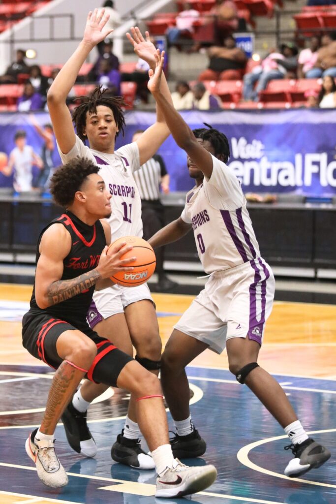 Fort White's Tafari Moe (0) drives to the basket against Crossroad Academy (Quincy) in the Rural State Semifinals. Photo by C.J. Gish
