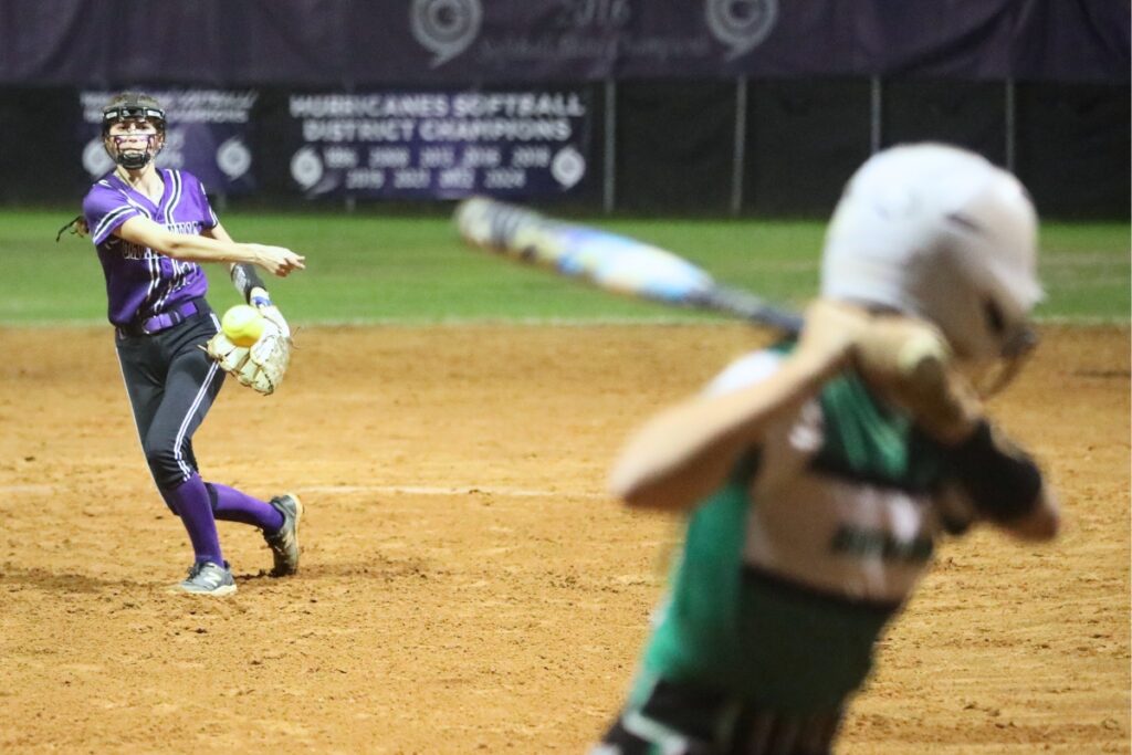 Gainesville's Josie Kirwan (13) pitches to Suwannee's Kirsten Yaun. Photo by C.J. Gish