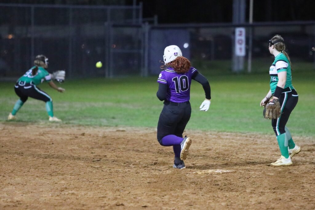 Gainesville's Madisyn Gillins (10) with a double in the bottom of the third inning against Suwannee. Photo by C.J. Gish