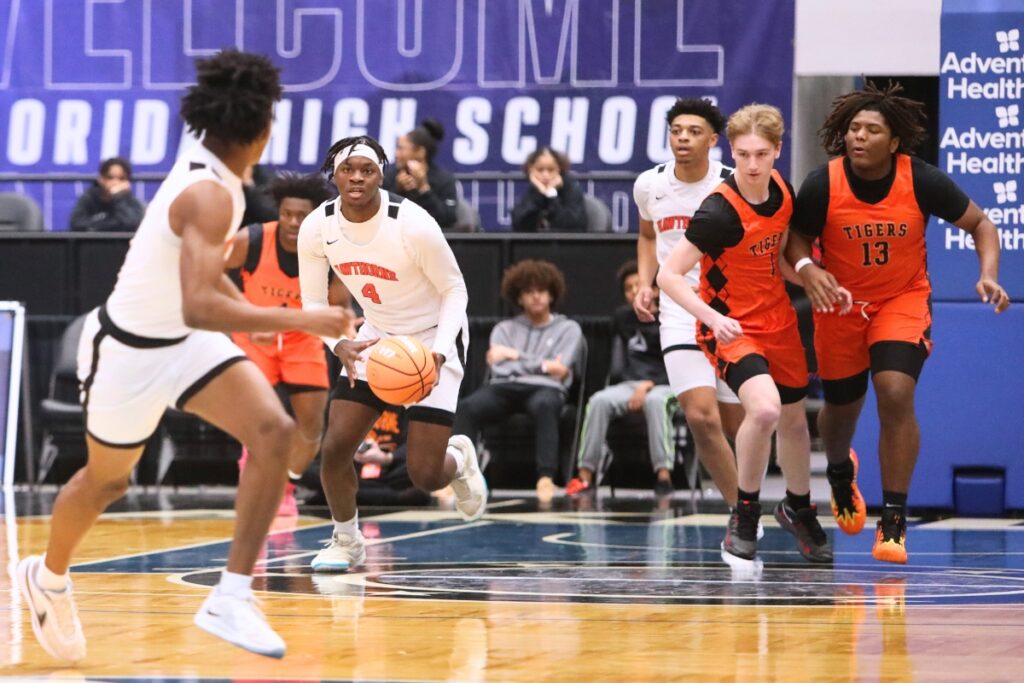 Hawthorne's Chasion Wilson (4) looks to pass to Dacarion Debose against Graceville in the Rural State Semifinals. Photo by C.J. Gish