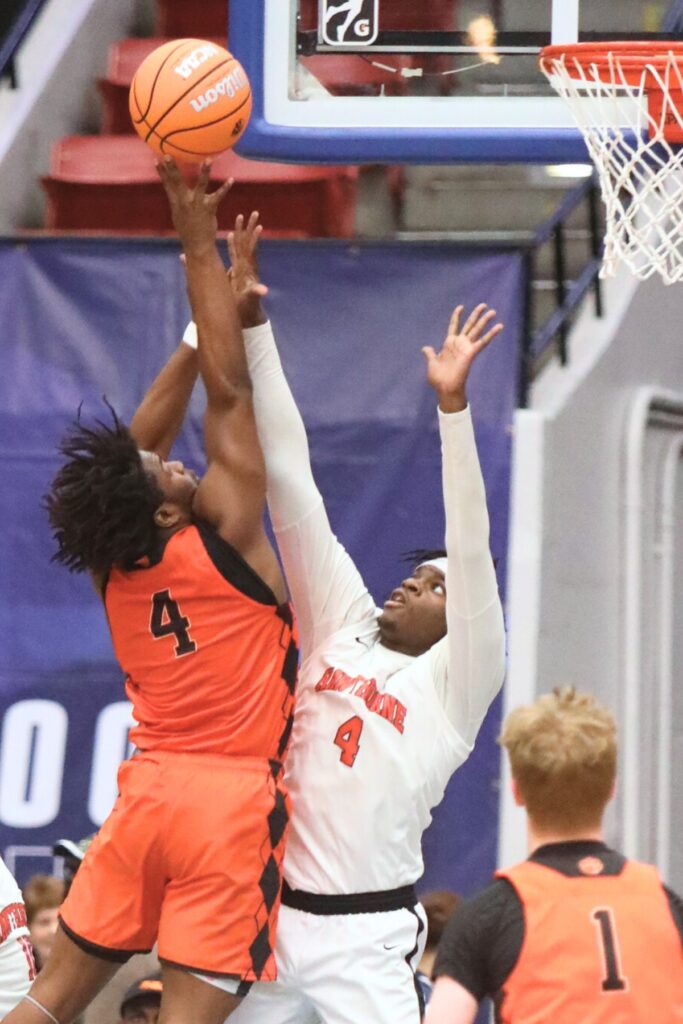 Hawthorne's Chasion Wilson (5) goes for a block against Graceville in the Rural State Semifinals.