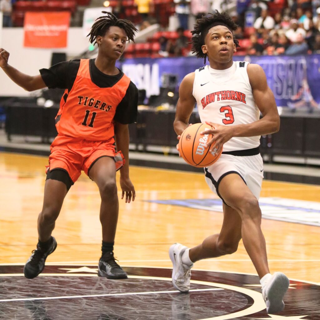 Hawthorne's Dacarion Debose (3) drives to the basket against Graceville in the Rural State Semifinals. Photo by C.J. Gish (2)