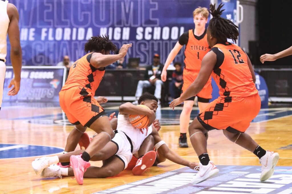 Hawthorne's Demetrius Brown (5) gets fouled against Graceville in the Rural State Semifinals. Photo by C.J. Gish