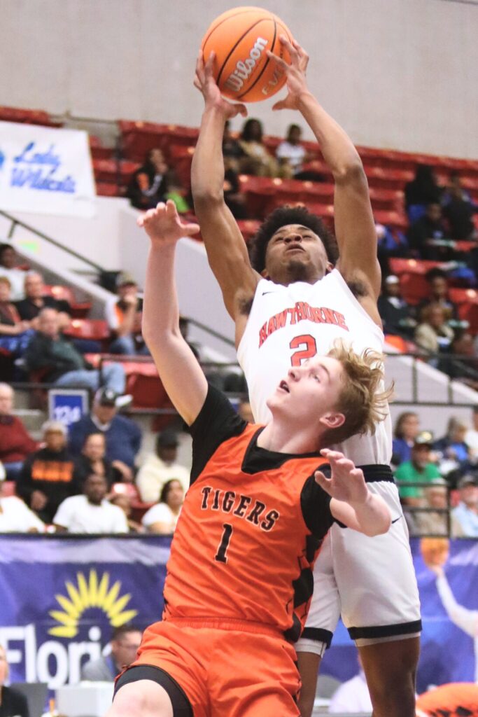 Hawthorne's Kelvin Baker (2) puts up a shot against Graceville in the Rural State Semifinals. Photo by C.J. Gish