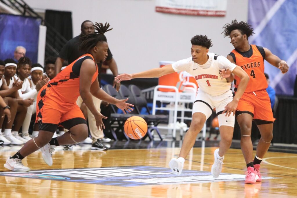 Hawthorne's Leland Johnson (1) goes for a steal against Graceville in the Rural State Semifinals. Photo by C.J. Gish