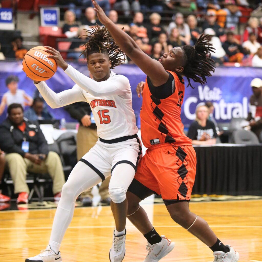Hawthorne's Nathan Jennings (15) drives to the basket against Graceville in the Rural State Semifinals. Photo by C.J. Gish