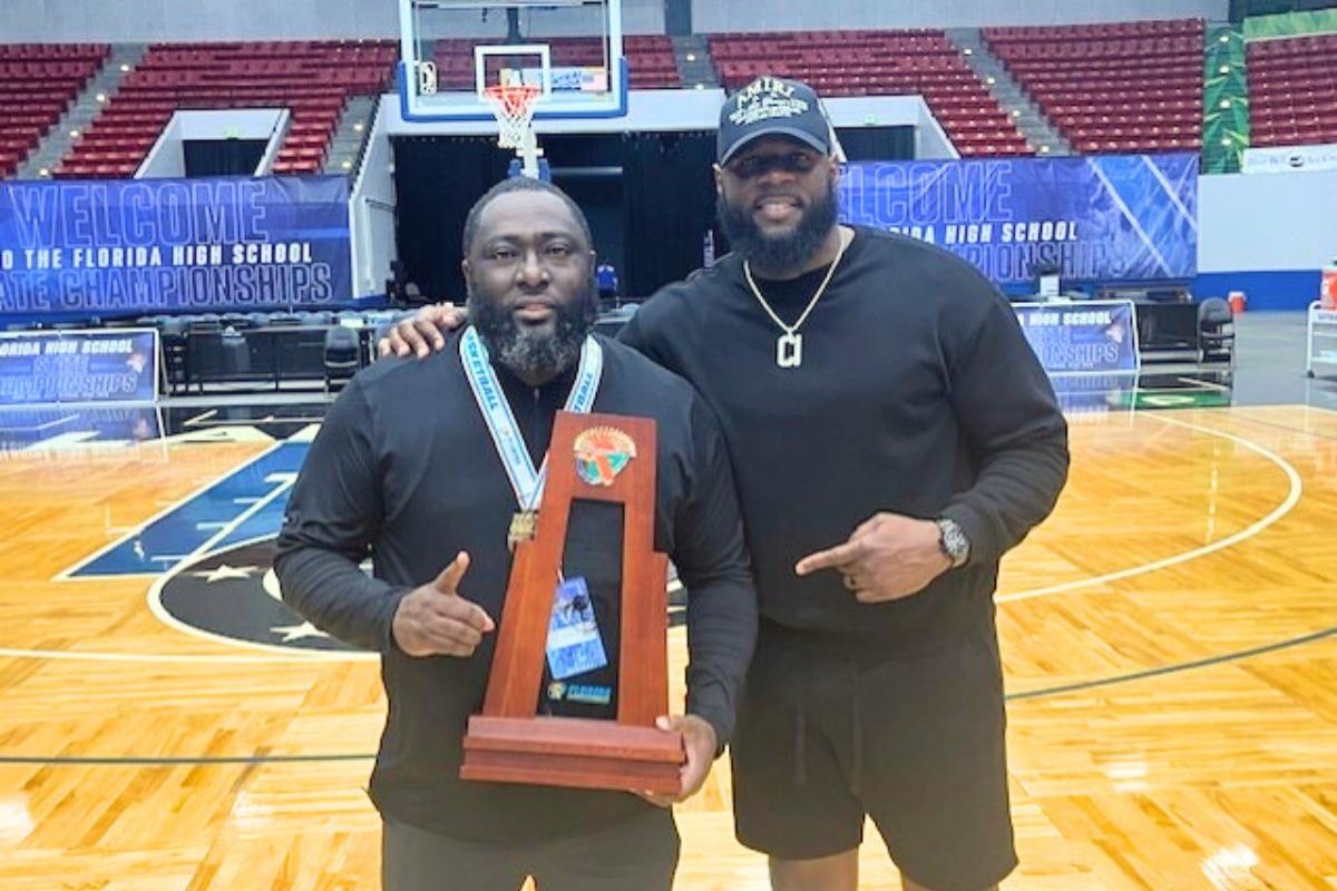 Head Coach Greg Bowie (left) and his brother Cornelius Ingram celebrate the win. Photo by Mike Ridaught