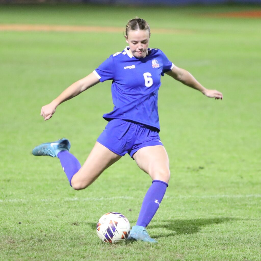 P.K. Yonge Emma Mansfield (6) boots the ball down the field against Maclay (Tallahassee). Photo by C.J. Gish