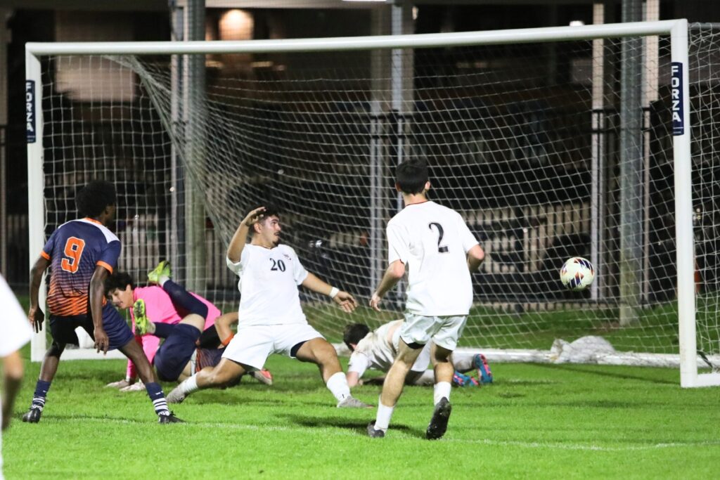 P.K. Yonge's Addisu Frisbie (9) kicks the ball just a little wide in the second half against Williston. Photo by C.J. Gish