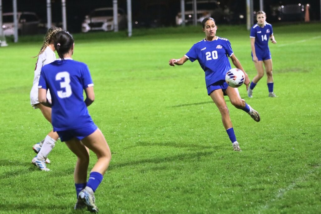 P.K. Yonge's Bella Young (20) kicks downfield against the Episcopal School of Jacksonville. Photo by C.J. Gish