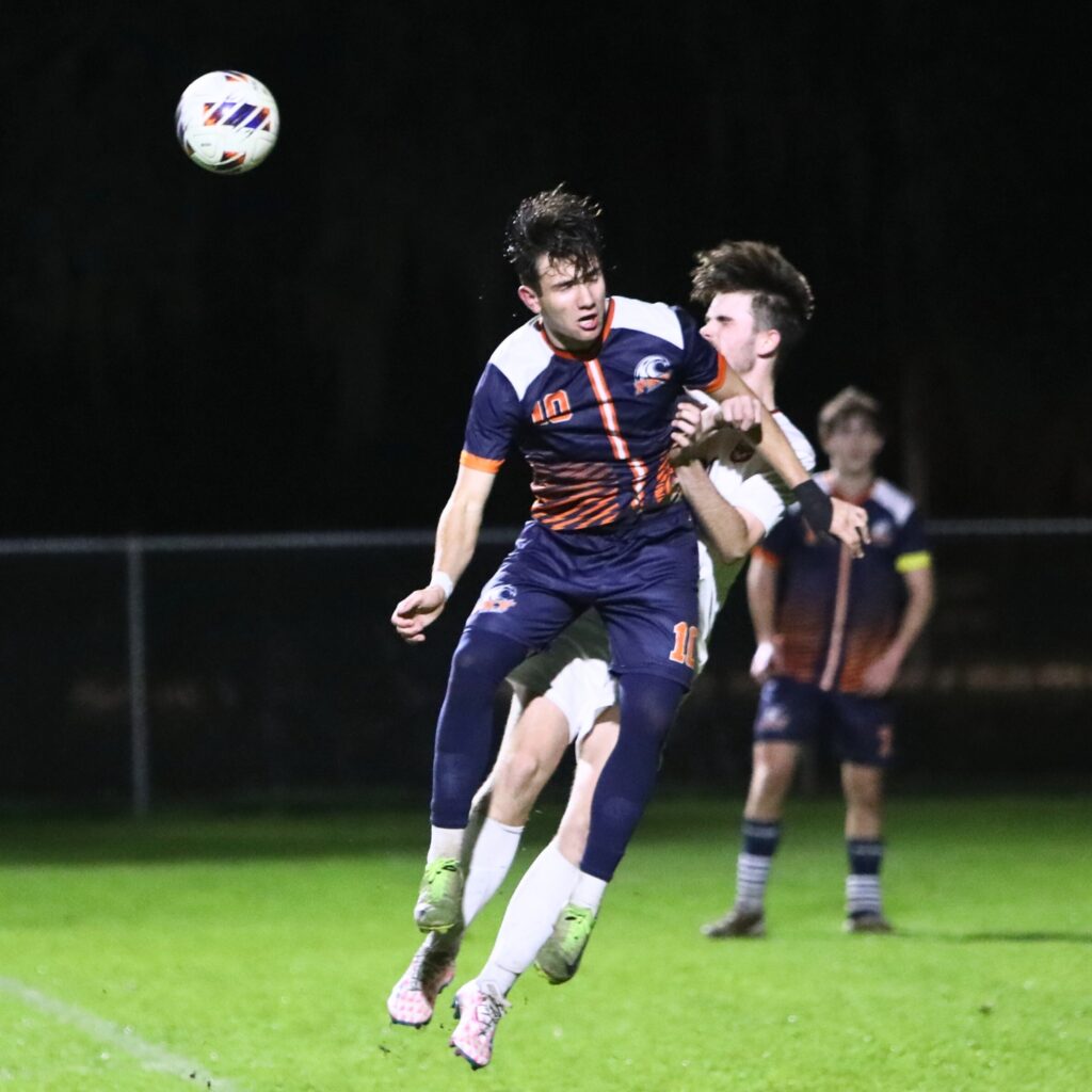 P.K. Yonge's Christopher Zeppieri (10) and Williston's Cole Francis-Landers (21) collide going for the ball. Photo by C.J. Gish 1 (1)