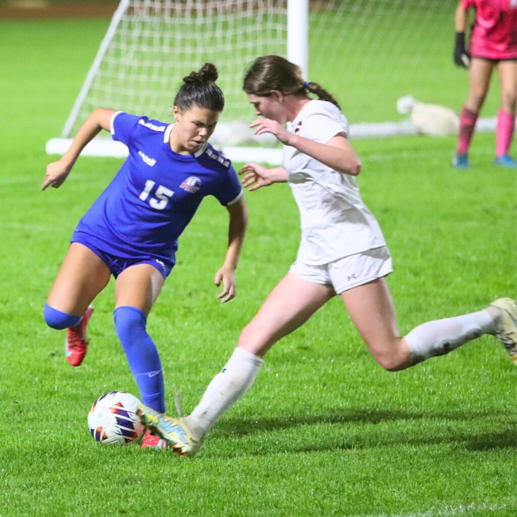 P.K. Yonge's Ellie Cervantes (15) batles for the ball against the Episcopal (Jacksonville). Photo by C.J. Gish 1