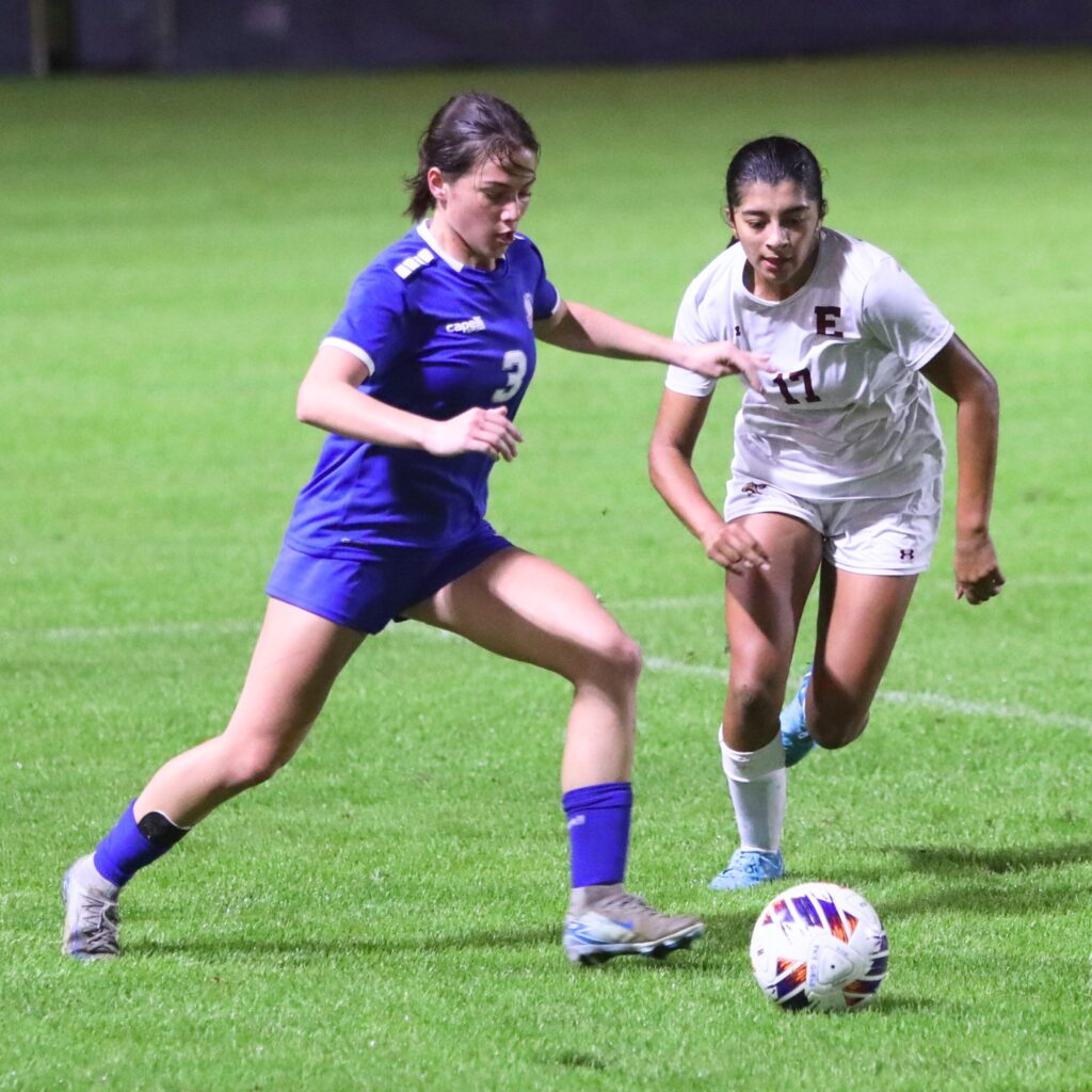 P.K. Yonge's Elliot Pancoast (3) battles for the ball against the Episcopal School of Jacksonville. Photo by C.J. Gish