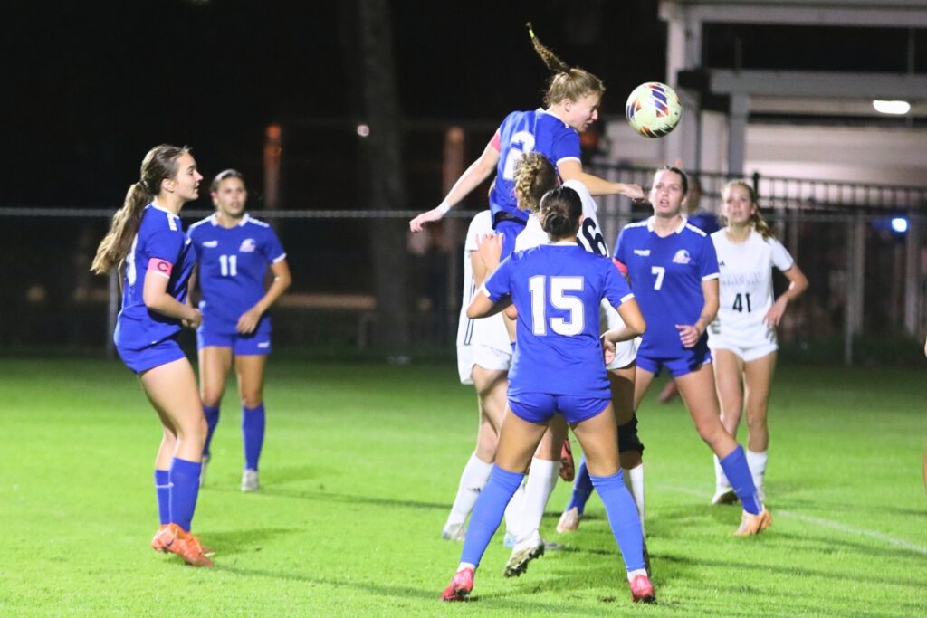 P.K. Yonge's Faith Hardy (2) attempts to score off a corner kick against Maclay (Tallahassee). Photo by C.J. Gish