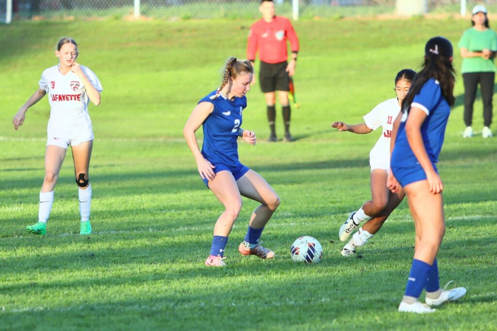 P.K. Yonge's Faith Hardy (2) dribbles the ball against Lafayette (Mayo). Photo by C.J. Gish 1