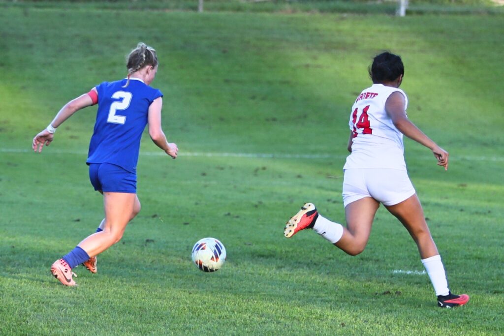 P.K. Yonge's Faith Hardy (2) goes in for the eighth and final goal in a win over Lafayette (Mayo). Photo by C.J. Gish 1