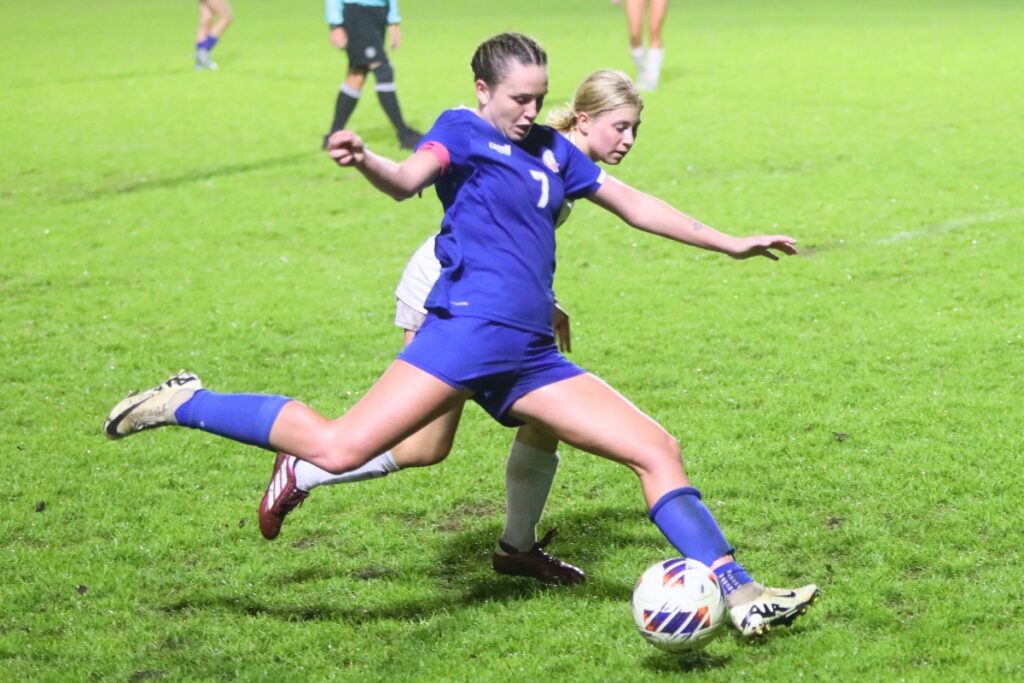 P.K. Yonge's Mae Dodd (7) kicks the ball downfield against the Episcopal School of Jacksonville. Photo by C.J. Gish