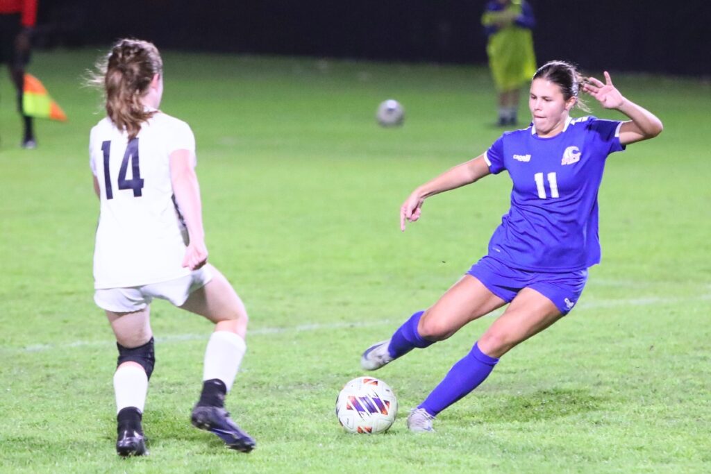 P.K. Yonge's Paulina Cervantes (11) maneuvers the ball past a Maclay (Tallahassee) player. Photo by C.J. Gish