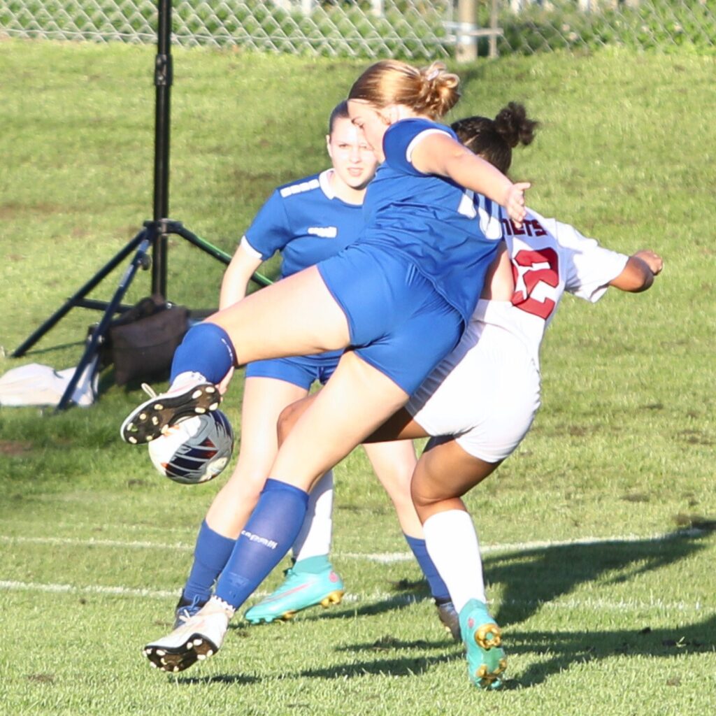 P.K. Yonge's Ryleigh Luca (10) battles for the ball against Lafayette (Mayo). Photo by C.J. Gish