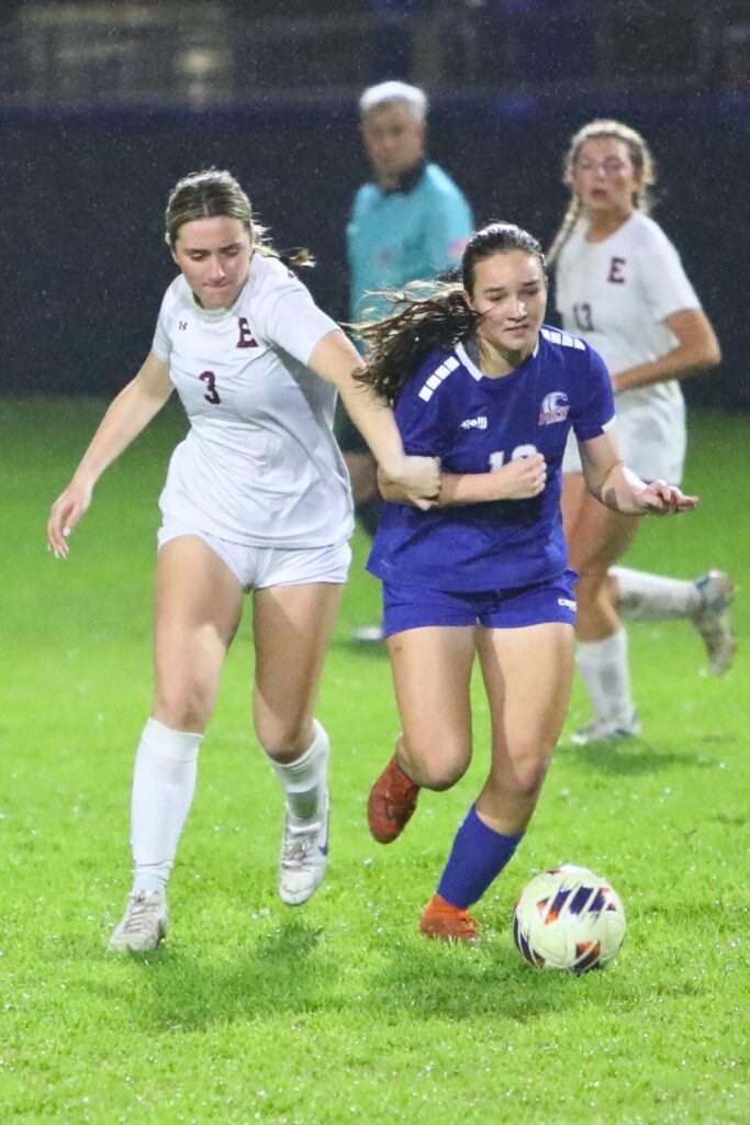 P.K. Yonge's Sydnie Colaw (18) battles for the ball against the Episcopal School of Jacksonville. Photo by C.J. Gish