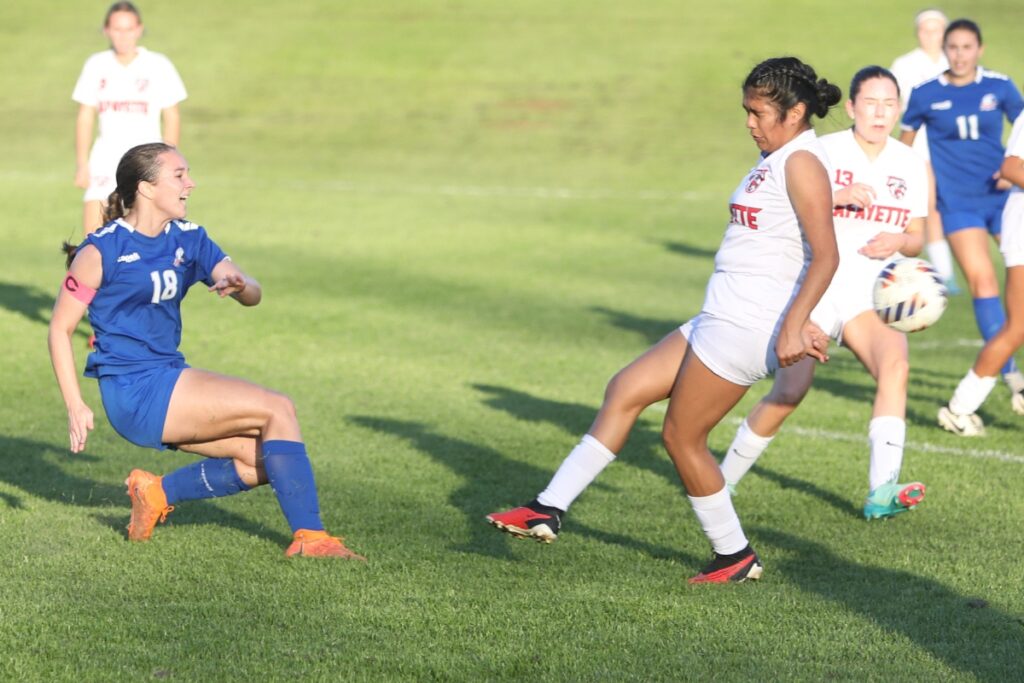 P.K. Yonge's Sydnie Colaw (18) with a pass against Lafayette (Mayo). Photo by C.J. Gish