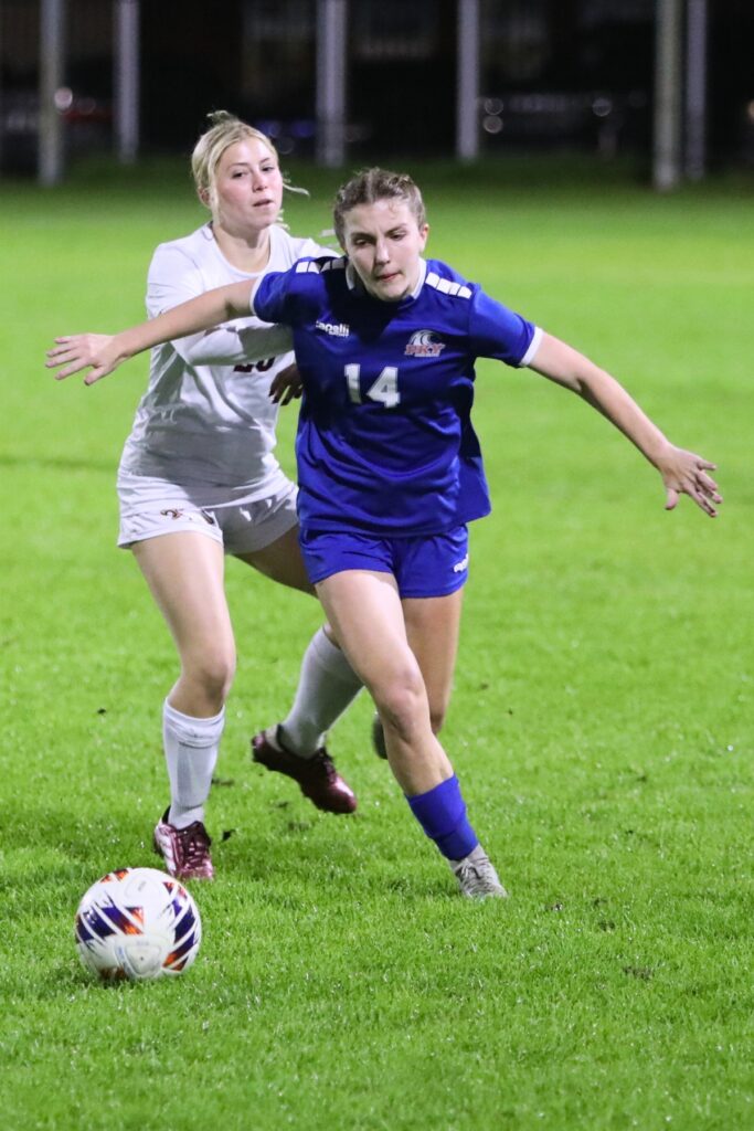 P.K. Yonge's T Tomlinson battles for the ball against the Episcopal School of Jacksonville. Photo by C.J. Gish