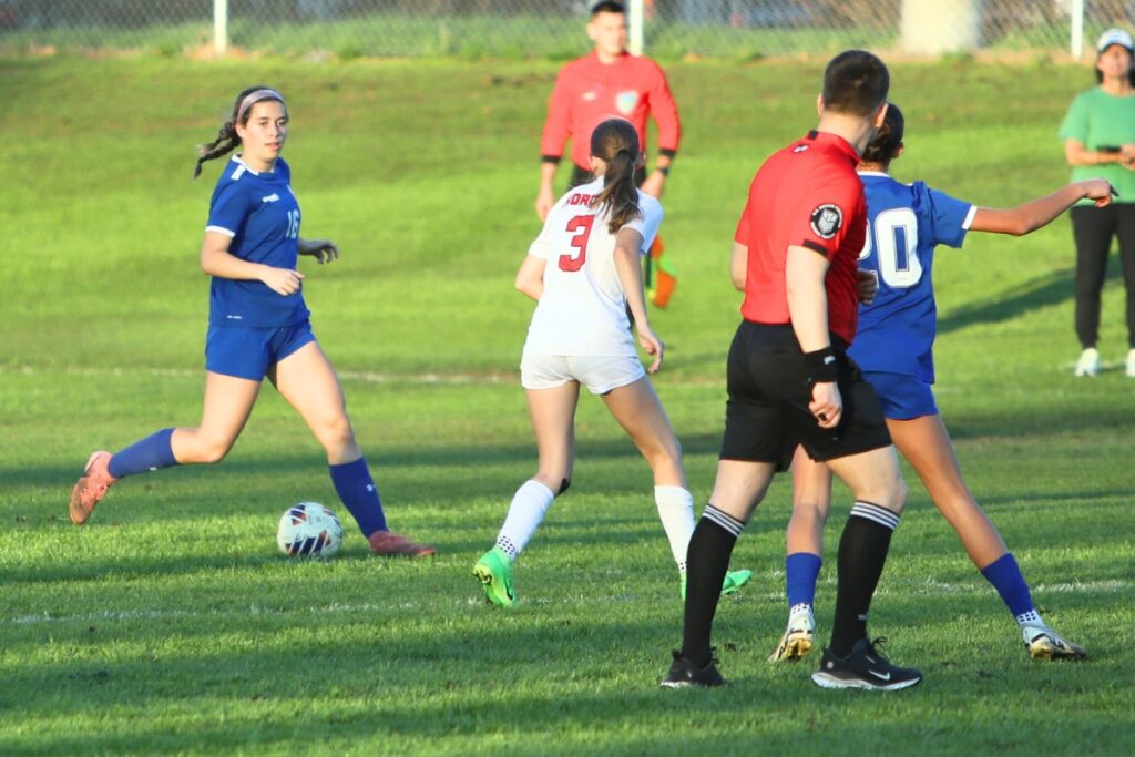P.K. Yonge's Taylor Hass (16) with the ball against Lafayette (Mayo). Photo by C.J. Gish