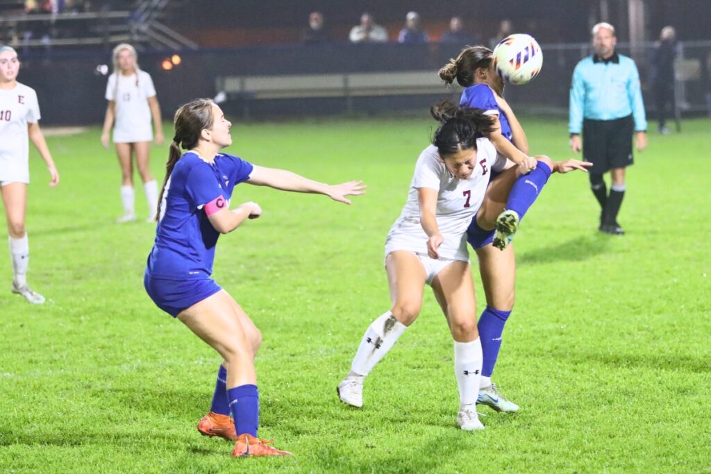 P.K. Yonge's Paulina Cervantes (11) battles for the ball against the Episcopal School of Jacksonville. Photo by C.J. Gish