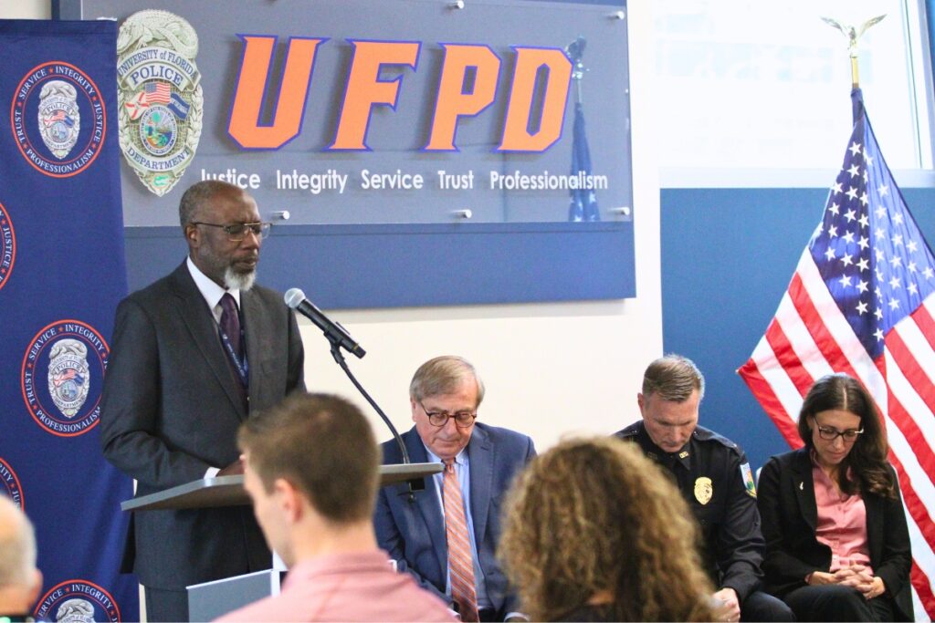 UFPD Chaplain and military veteran Bishop Christopher Stokes issues a prayer at Knowles' swearing in. Photo by Lillian Hamman