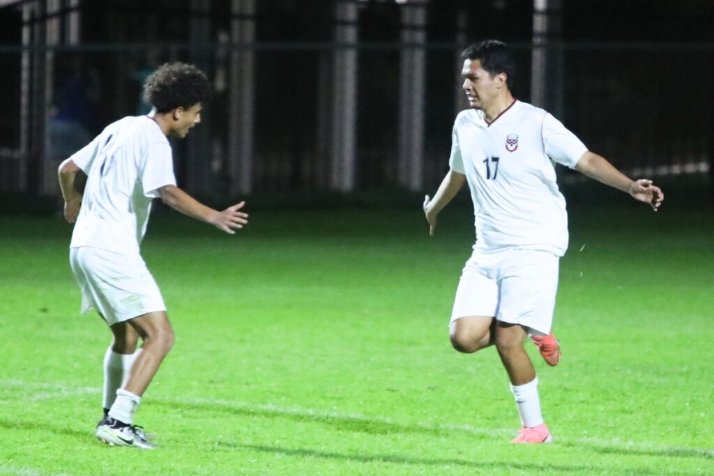 Williston's Mike De La Cruz (17) celebrates with Yandel Muijca (18) after scoring the game's first goal against P.K. Yonge. Photo by C.J. Gish