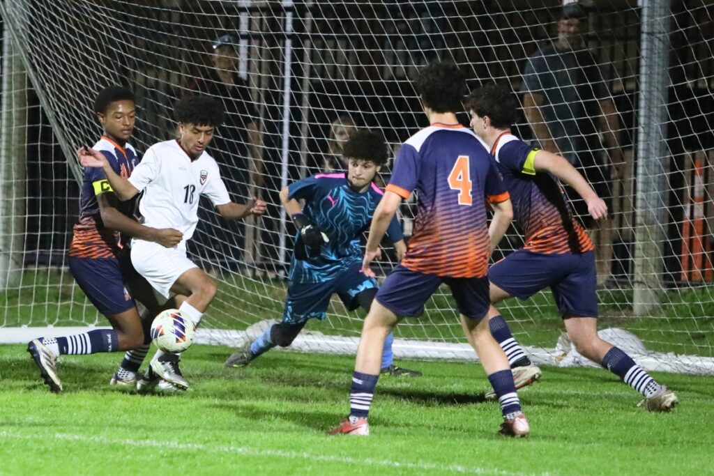 Williston's Yandel Mujica (18) attempts to score against P.K. Yonge in the first half. Photo by C.J. Gish