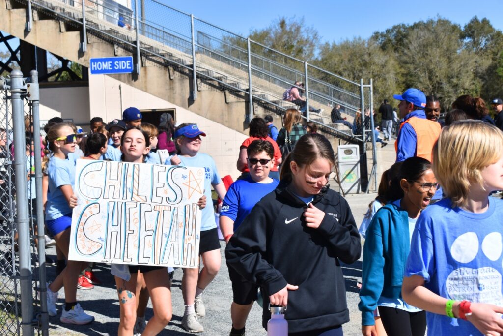 A Chiles Elementary student shows her school spirit on the way in to Citizens Field. Photo by Glory Reitz