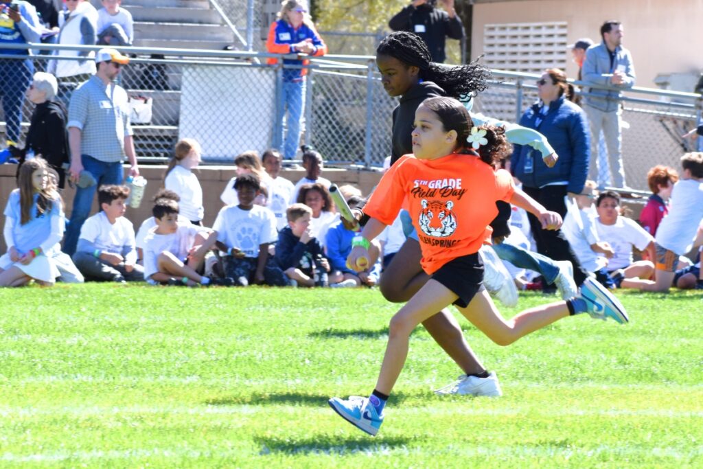 A Glen Springs Elementary student takes the lead in the baton relay. Photo by Glory Reitz