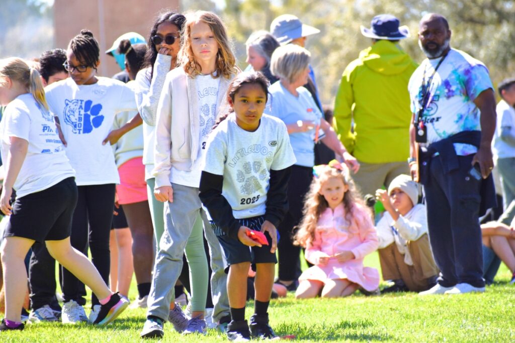 A Littlewood Elementary student prepares to throw a bean bag at the target. Photo by Glory Reitz