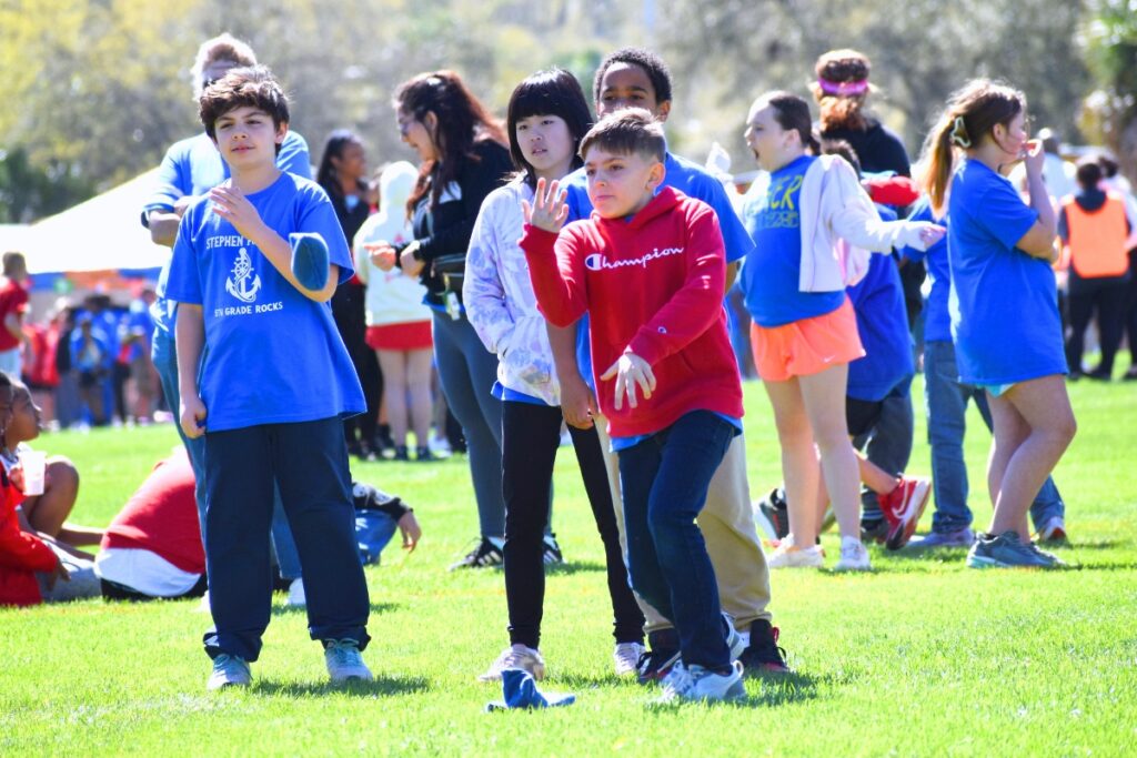 A Stephen Foster Elementary student lets his bean bag fly. Photo by Glory Reitz