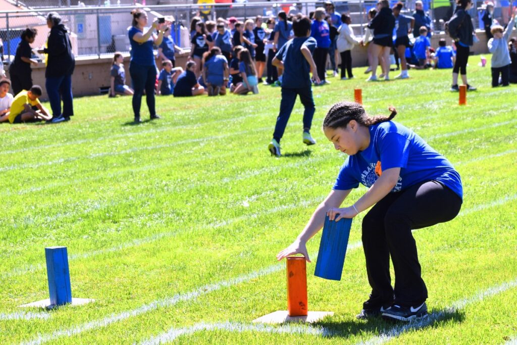A Wiles Elementary student switches out blocks in the block relay. Photo by Glory Reitz