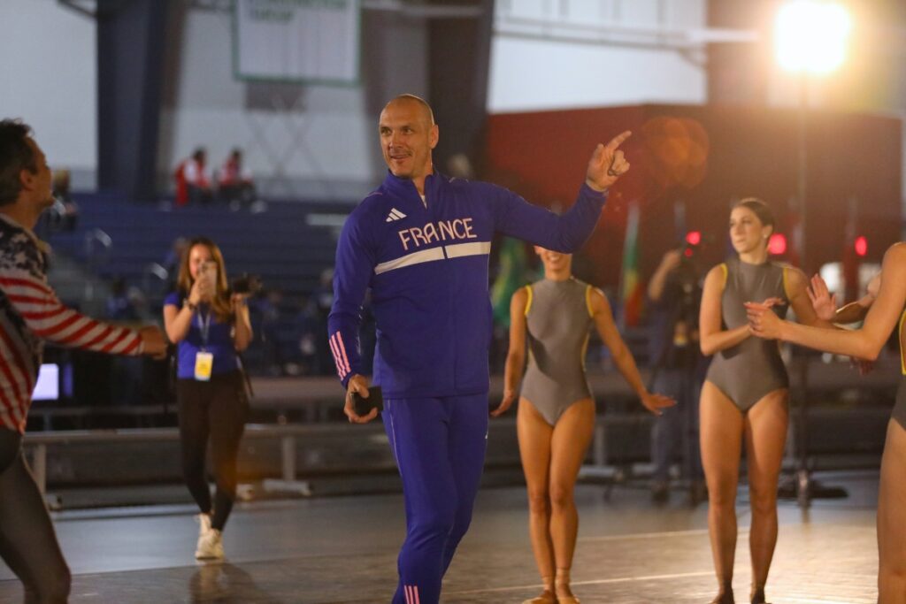 A member of Team France starts the dance party after the opening ceremony. 