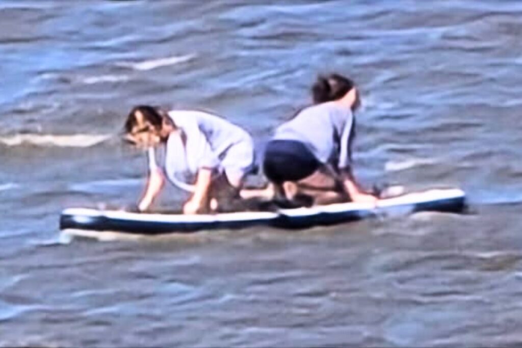 A photo taken on Monday of the two teenage girls who were floating on a paddleboard on a trip from