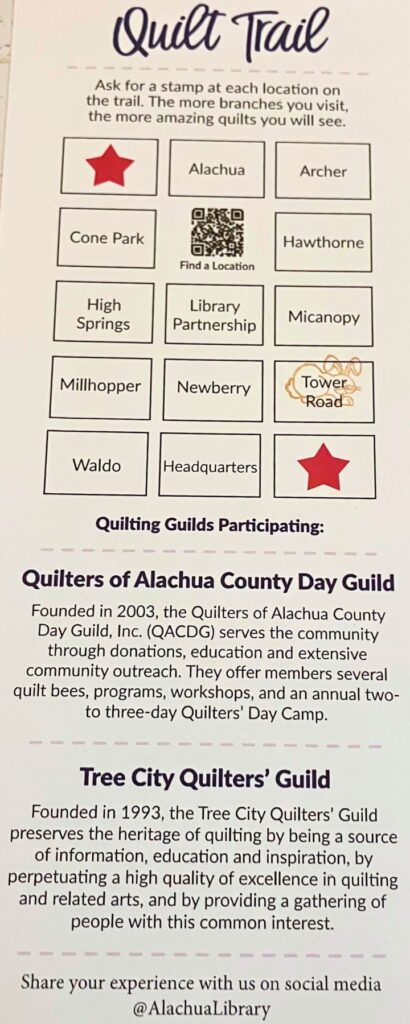 Artwork from various quilt guilds hanging on display in the Tower Road Branch library for 2025 Quilt Trail. Photo by Lillian Hamman (1)