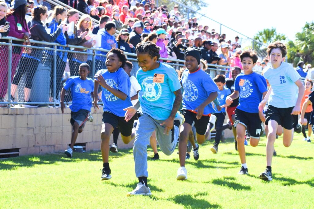 Boys launch into the one-mile race. Photo by Glory Reitz