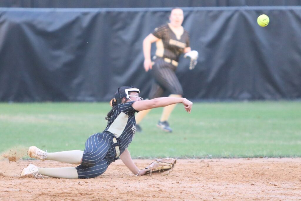 Buchholz's Madison Blackford attempts to throw a Newberry batter out at first base in the fourth inning. Photo by C.J. Gish