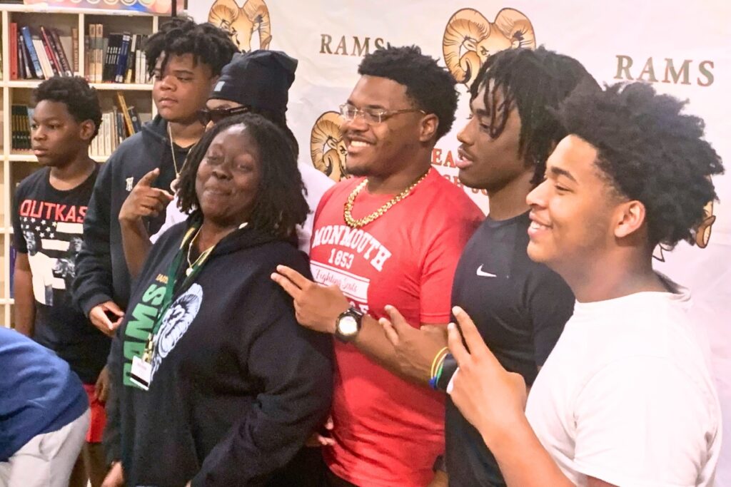 Eastside's Jaquez Whitehead (red shirt) signed to play football with