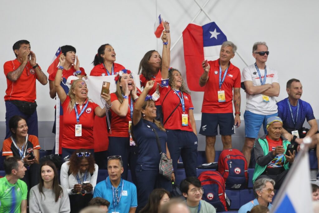 Fans for Team Chile celebrate as the country's flag starts around the track. 