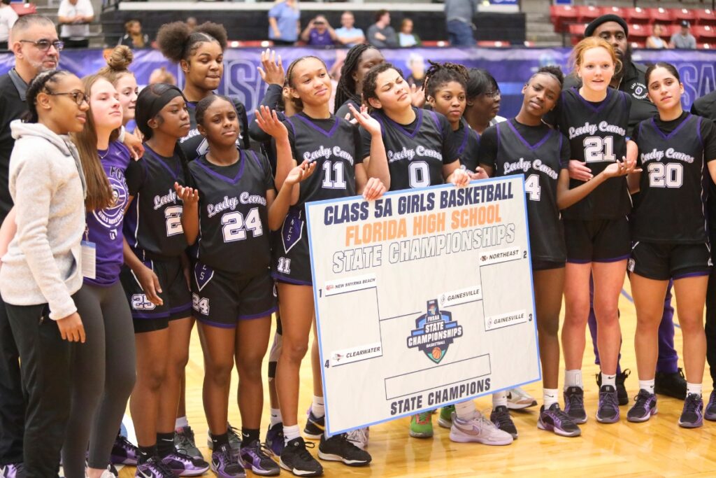 Gainesville players with the championship bracket following a 54-52 win over Northeast (Oakland Park) in the Class 5A state semifinals. Photo by C.J. Gish