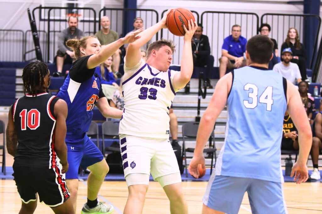 Gainesville's Aidan Bell with a rebound against Bronson's Cian Ronaldo at The Prep Zone All-Star Showcase. Photo by C.J. Gish