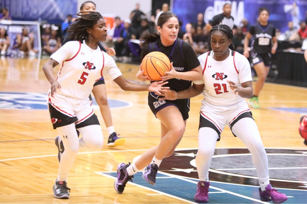 Gainesville's Catalina Giraldo Vergara (20) drives to the basket against Northeast (Oakland Park) in the Class 5A state semifinals. Photo by C.J. Gish